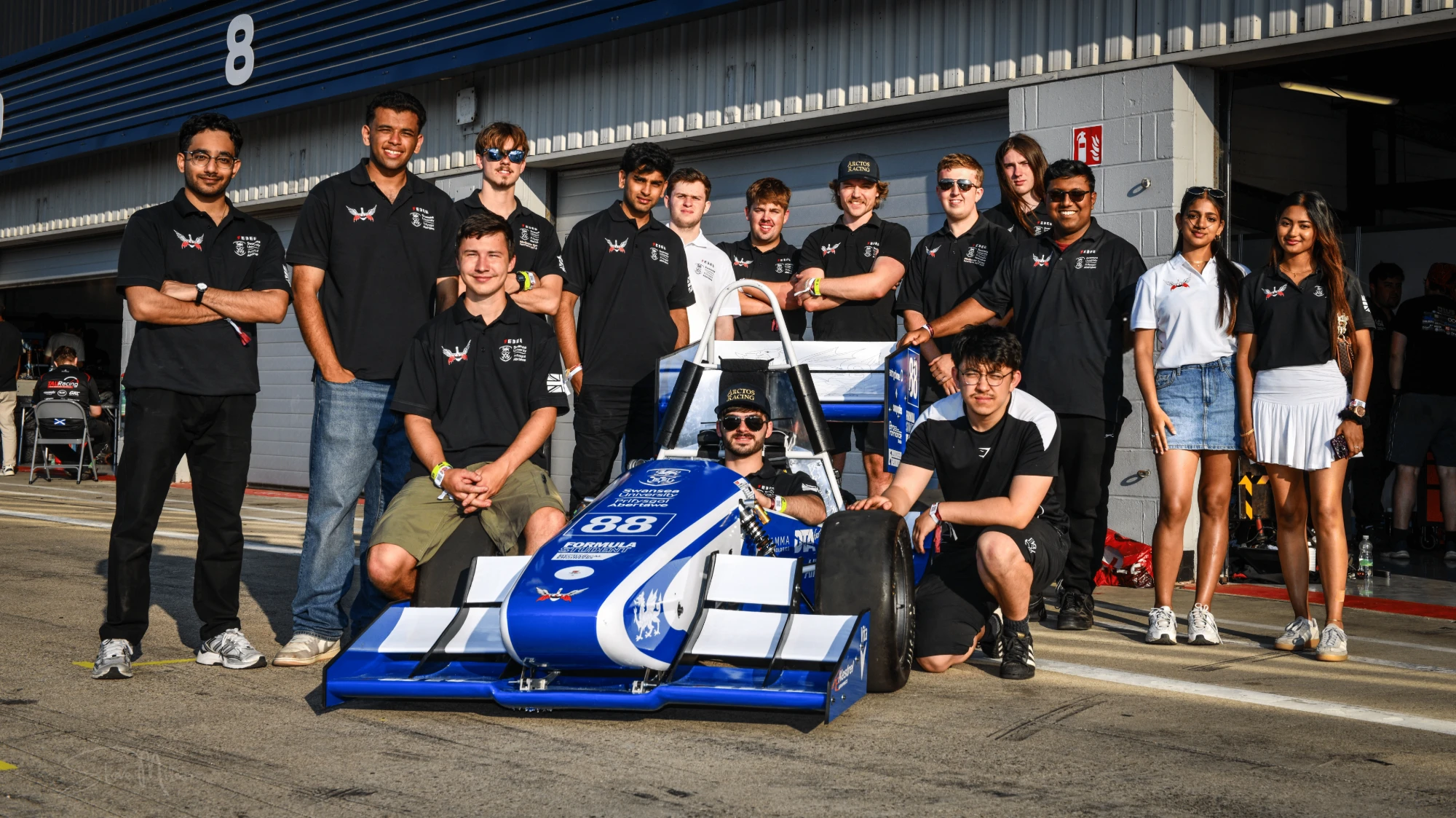 Swansea University Race Engineering team with the car at Silverstone